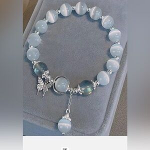 Elegant White and Silver Beaded stretch Bracelet with Butterfly Charm